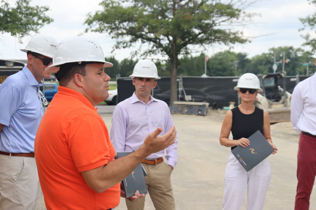 Maryland Department of Housing and Community Development Secretary Jake Day visits Port Street Commons and speaks with Jonathon Rondeau